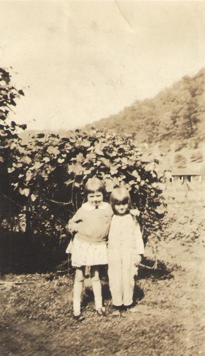 Pike County, Indiana, Unidentified Children, Young Girls Embracing in Front of Bushes