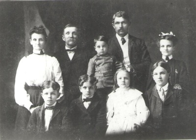 Family standing together in dress clothes