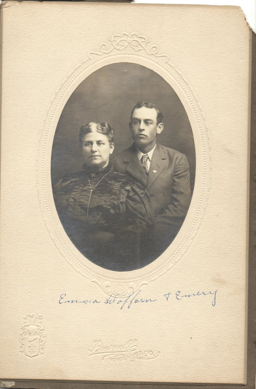 Mother and son seated together in dress clothes