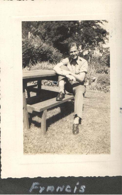 Soldier seated at picnic table