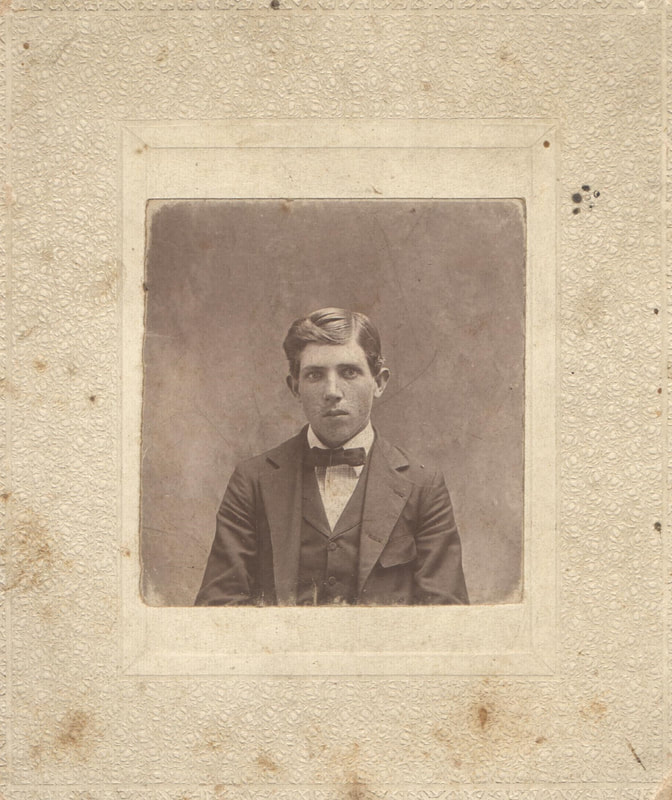 Young man in suit and bow tie