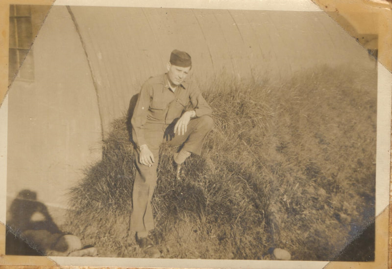 Pike County, Indiana, Veterans Collection, U.S. Army, Soldier Crouching in Grass, 1st Lieutenant John T. Brittain, May 1945 