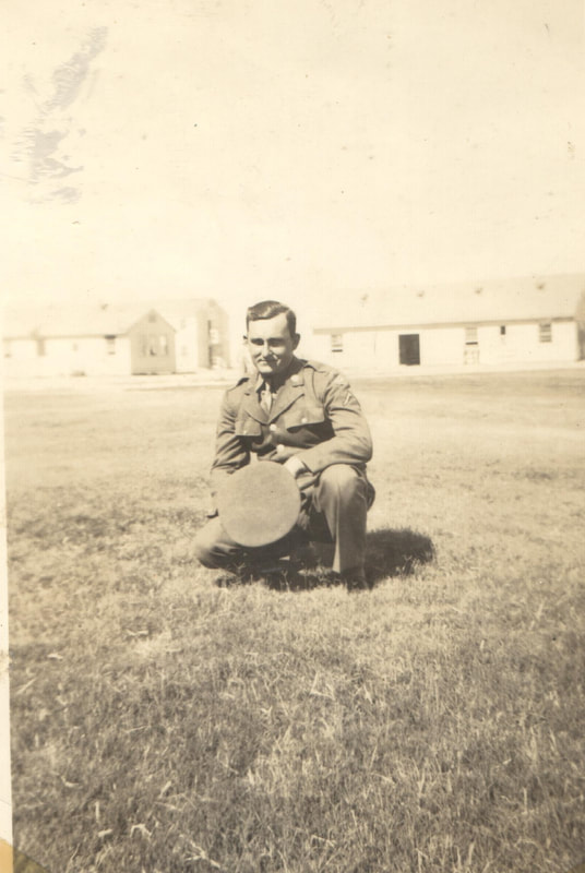 Pike County, Indiana, Veterans Collection, Soldier Crouches in Yard, Norman Buchta, May 1945