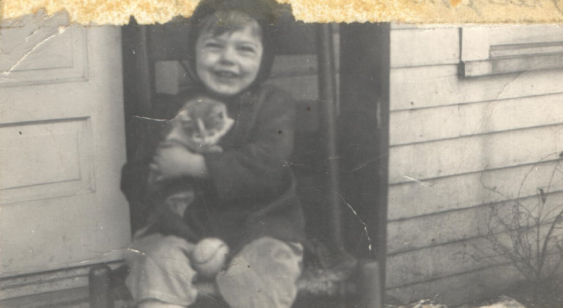 Young boy holding kitten