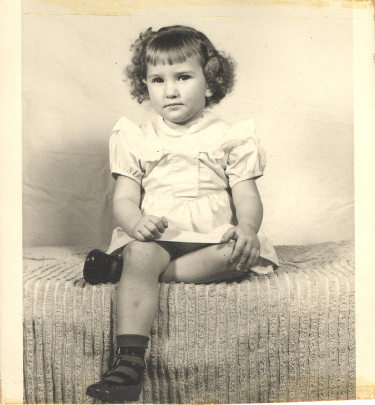 Young girl with brown hair seated