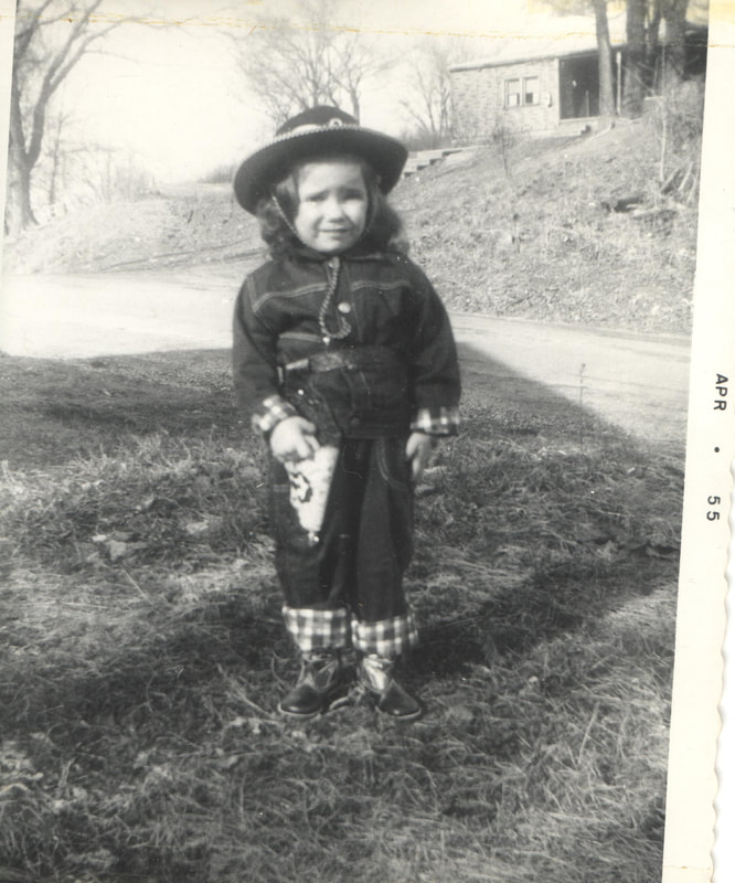 Young girl in cow boy outfit