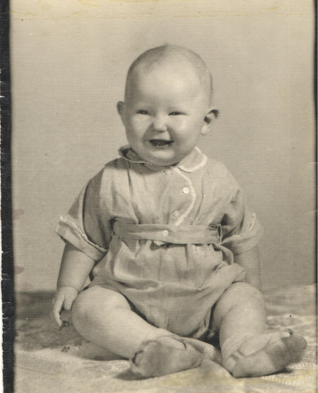 Smiling baby boy seated