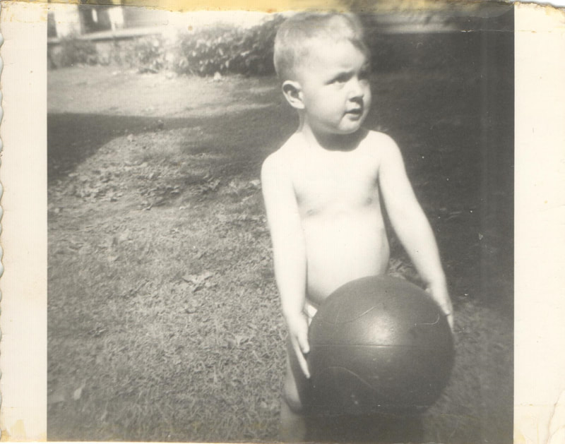 Young boy holding basketball