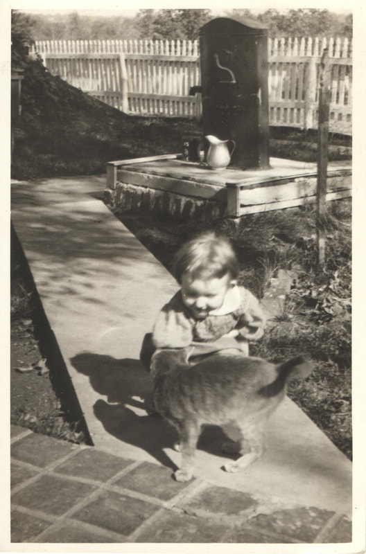 Pike County, Indiana, Robling Family, Young Girl With Cat Crouching on Sidewalk
