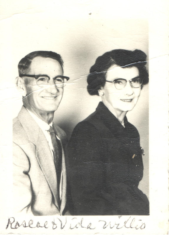 Man and woman seated in dress clothes