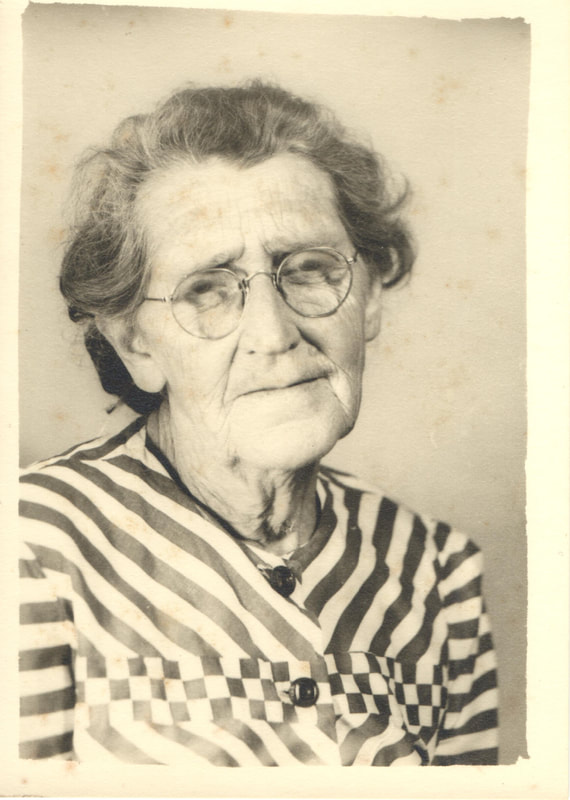 Elderly woman in striped dress