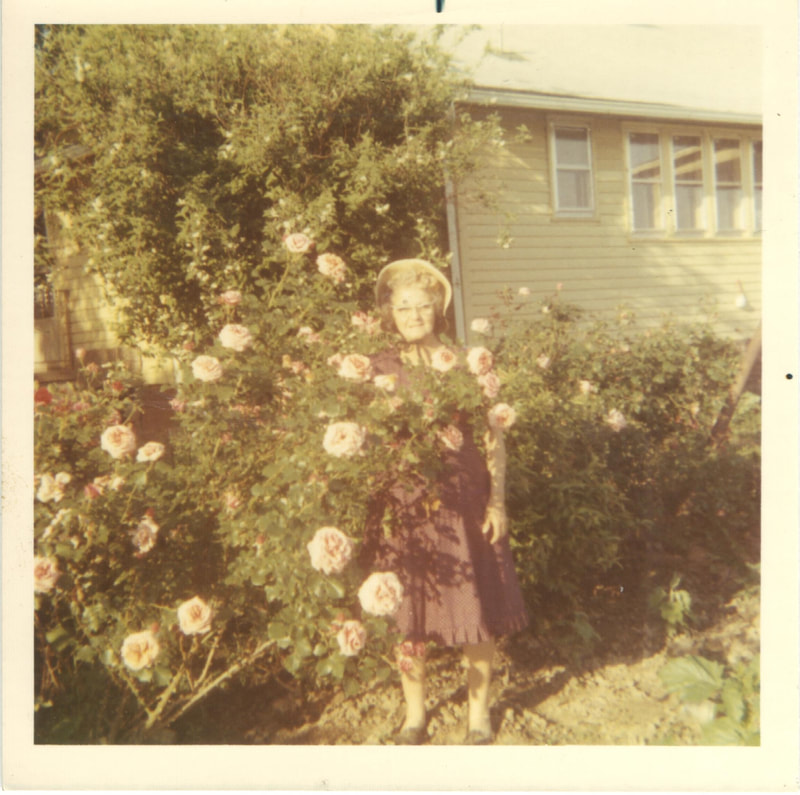 Woman standing in flower bush