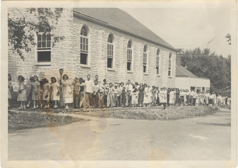 Large gathering of people outside of church