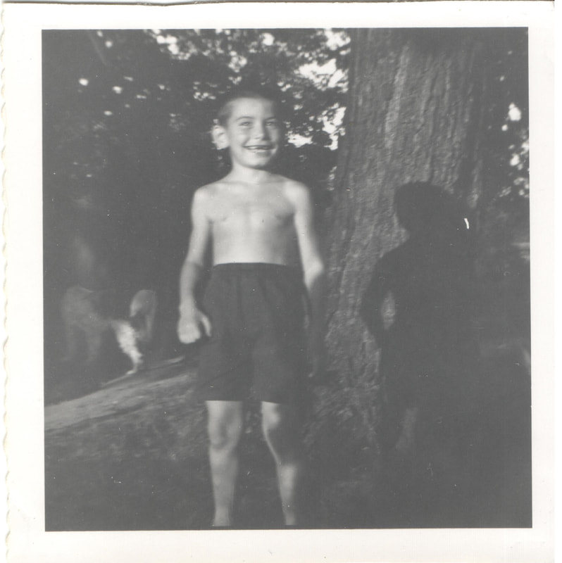 Young boy in swim trunks