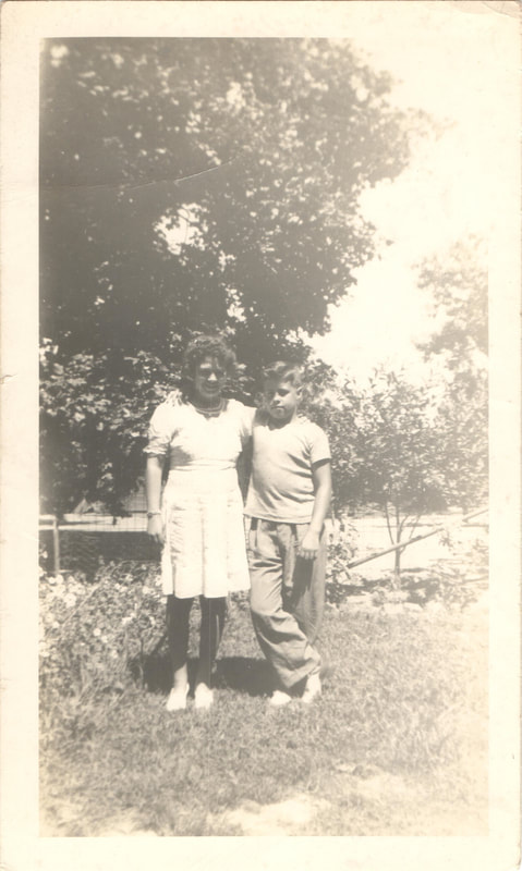 Young woman and young man standing together outdoors
