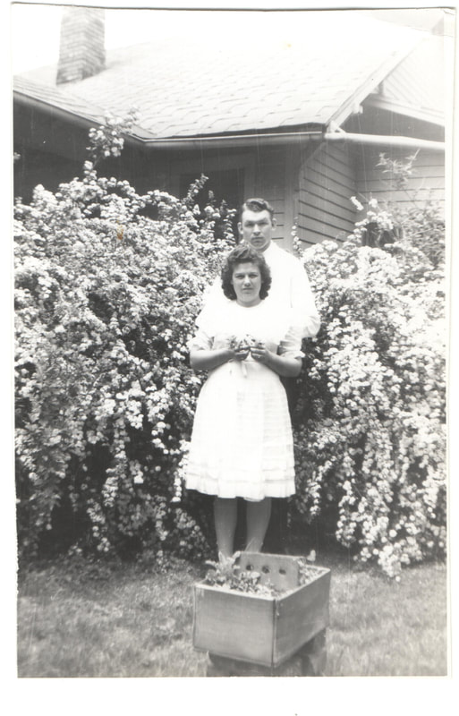 Man and woman standing together in garden