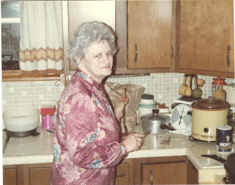 Elderly woman prepping food in kitchen