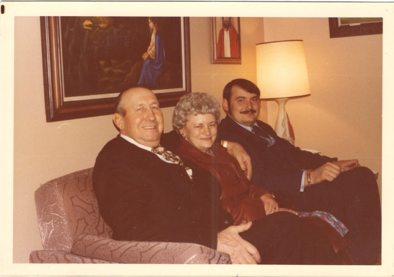 Family seated together on couch