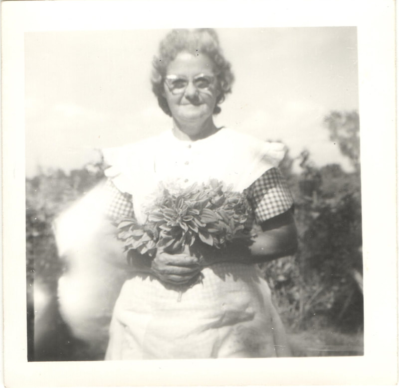 Woman holding flowers in garden