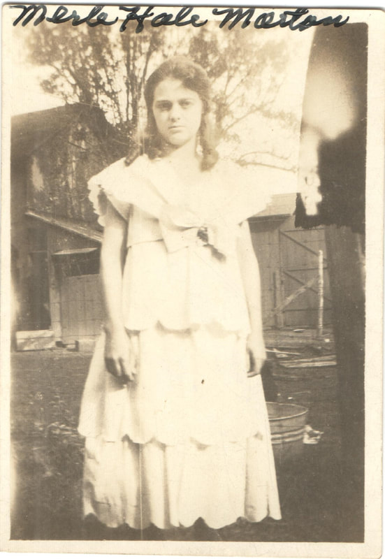 Young woman standing in yard