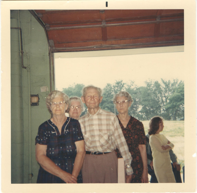 Elderly people standing together at family reunion 