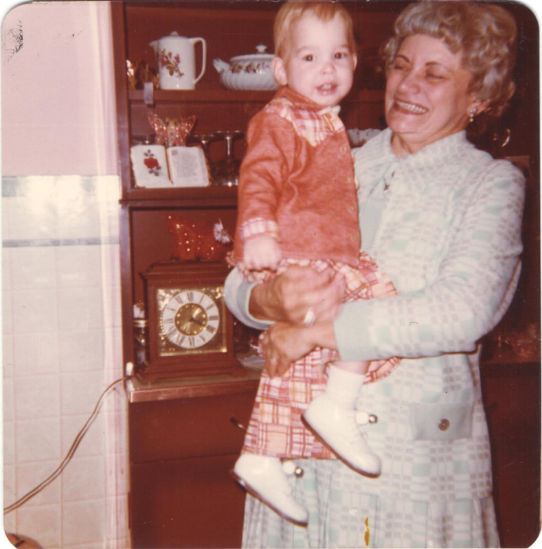 Elderly woman holding young boy
