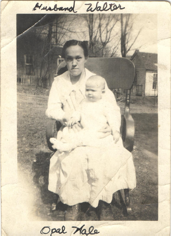 Woman seated holding baby