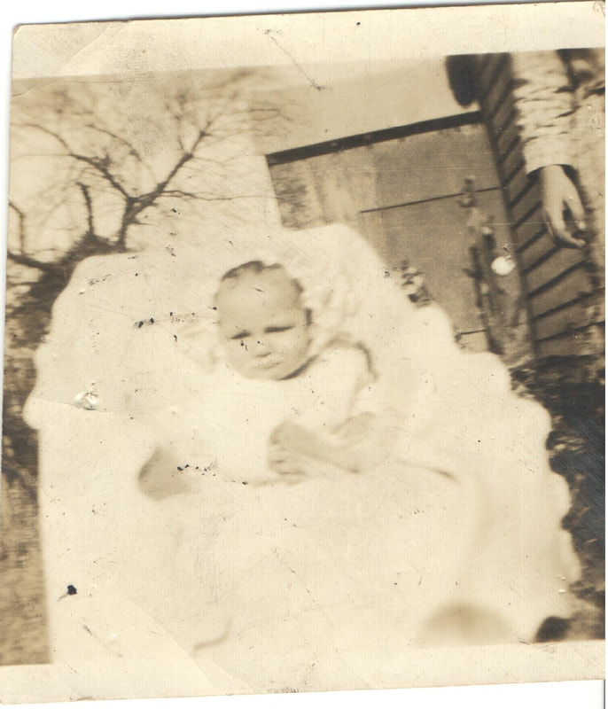 Baby with cap in carriage