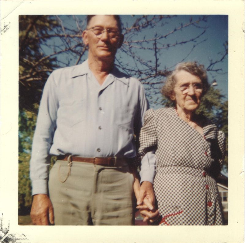 Elderly woman and man holding hands outdoors