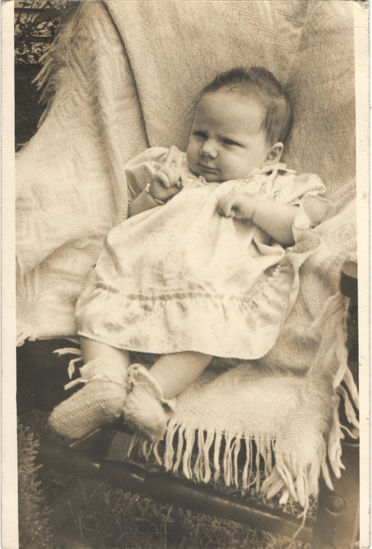 Baby seated in chair