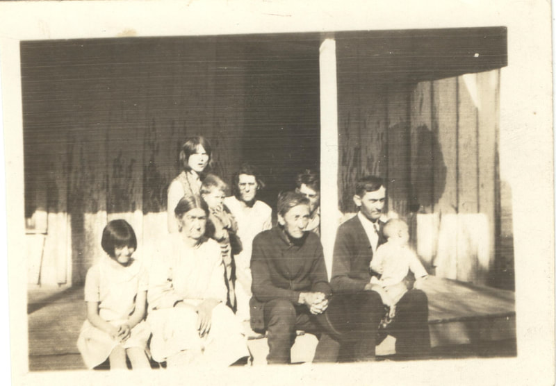 Family seated together on porch