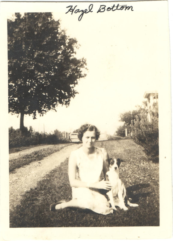 Young woman seated with dog