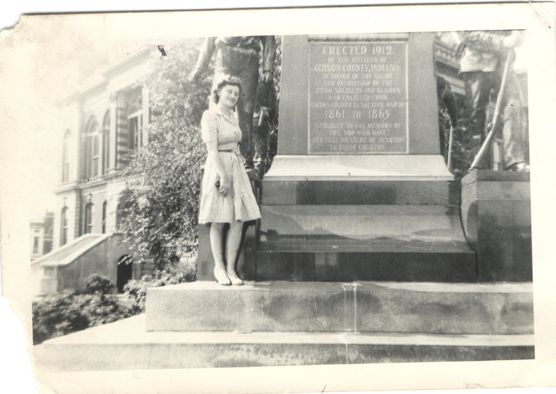 Woman standing in front of monument