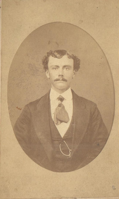 Man with mustache and tie
