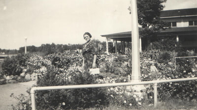 Pike County, Indiana, Judd Family, Woman Holding Purse Standing in Garden, Zedith Judd 