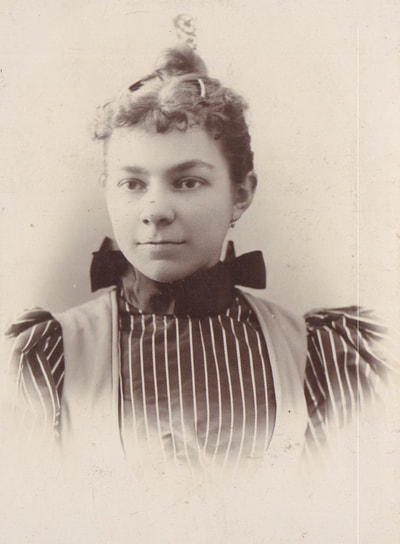 Young woman in striped dress with bowtie