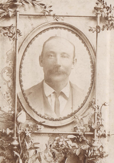 Man with mustache in suit