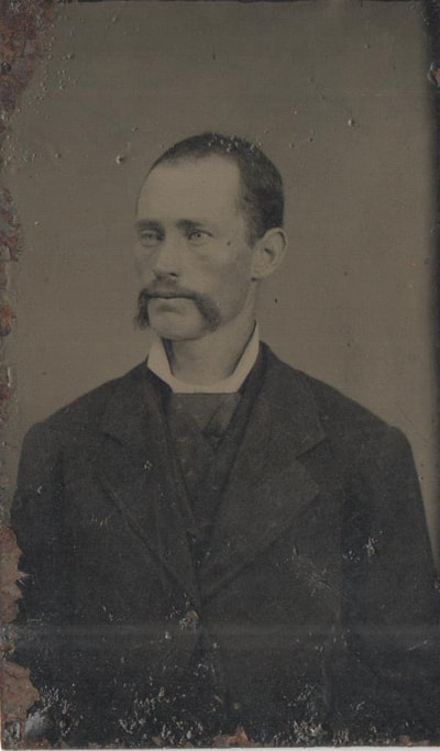 Man with mustache and dress clothes