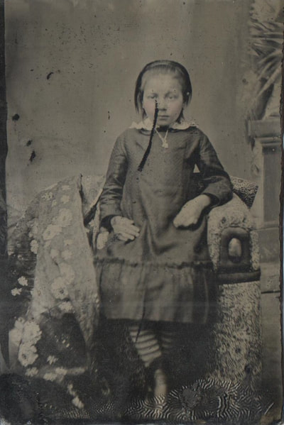 Young girl in necklace standing