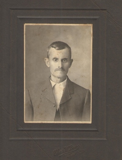 Man with mustache in suit