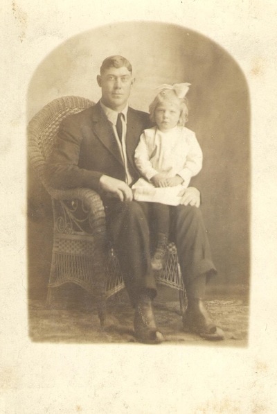 Man Seated With Young Girl