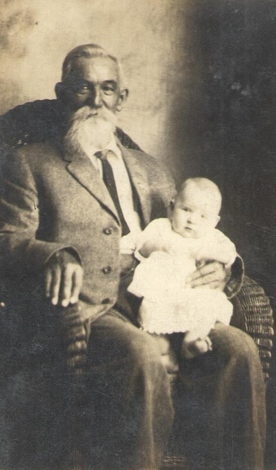 Elderly Man Seated With Baby