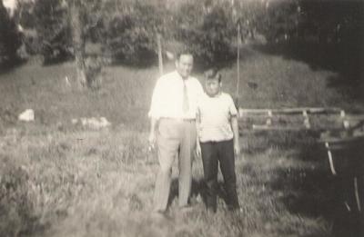 Man and boy standing together outdoors