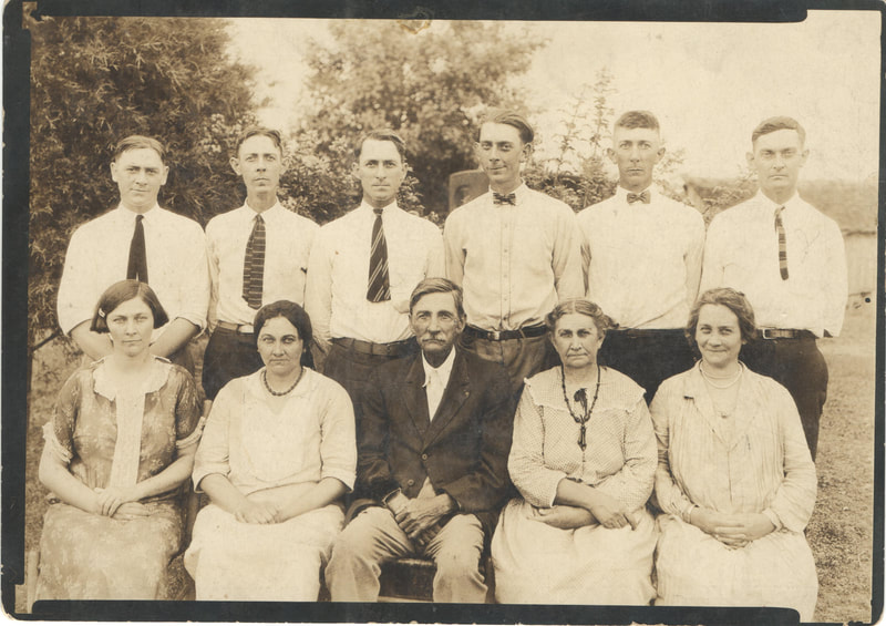 Family gathered in formal dress