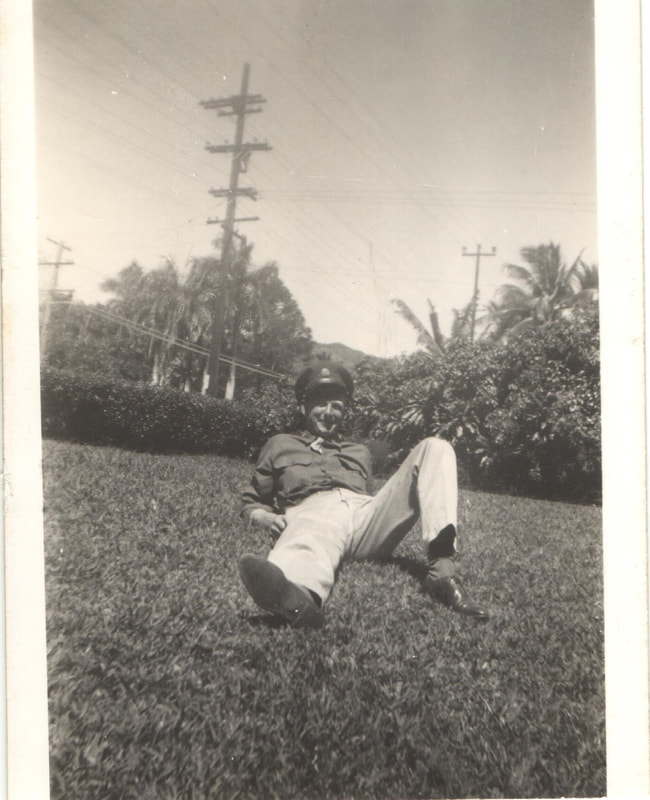 Soldier in service uniform lying on ground