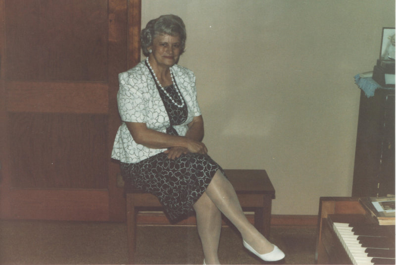 Elderly woman sitting on stairs