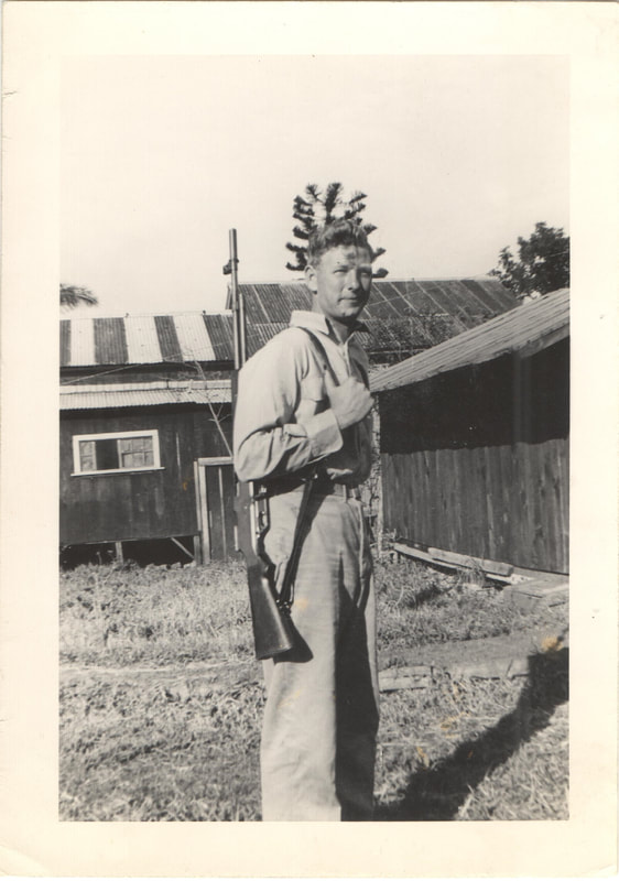 Soldier standing with rifle 