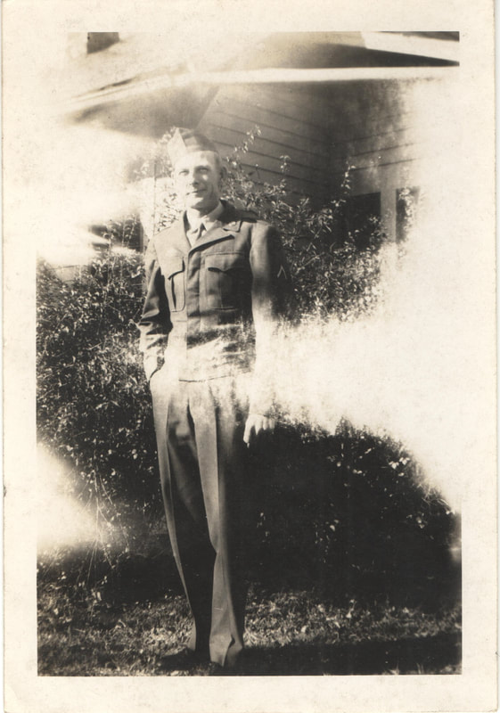 Soldier standing in front of home